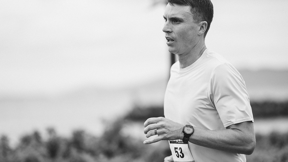 Black And White Image Of A Male Runner Finishing A Marathon With The Post Marathon Blues