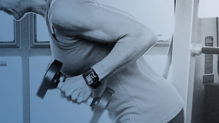 Woman Does Tricep Kickback While Strength Training For Triathletes Woman Does Tricep Kickback With Apple Watch, Blue Overlay