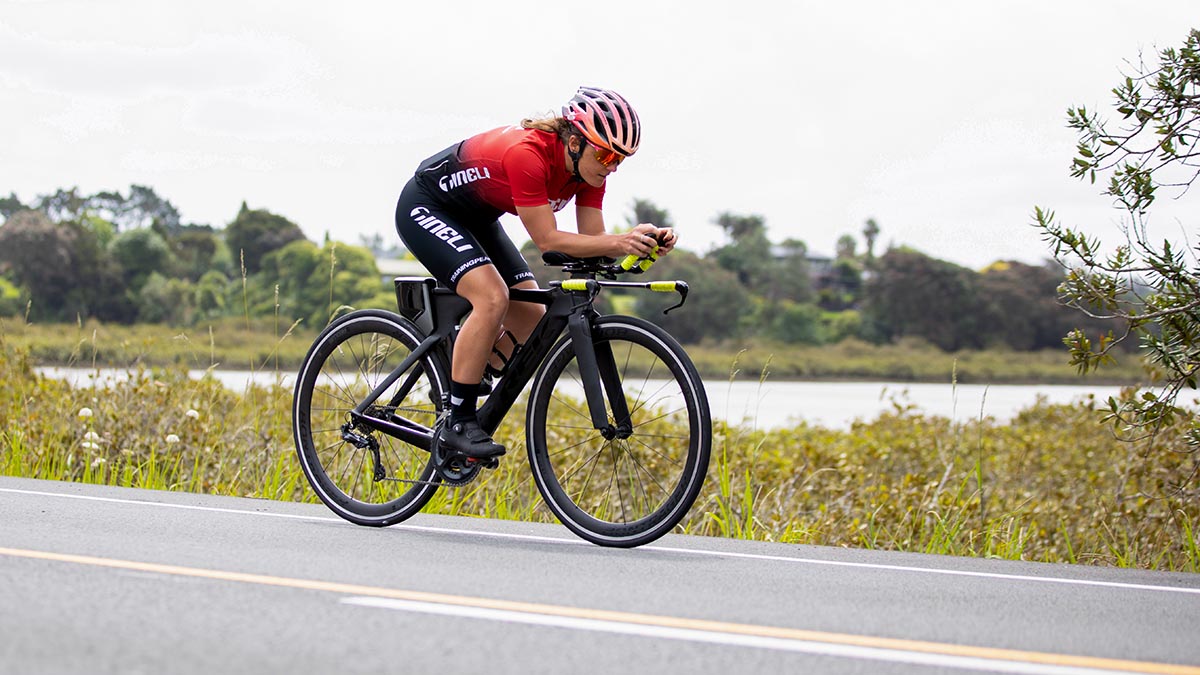 Cycling Aero Over Power 20031 A Woman On A Time Trail Bike On The Aero Bars Riding On A Road