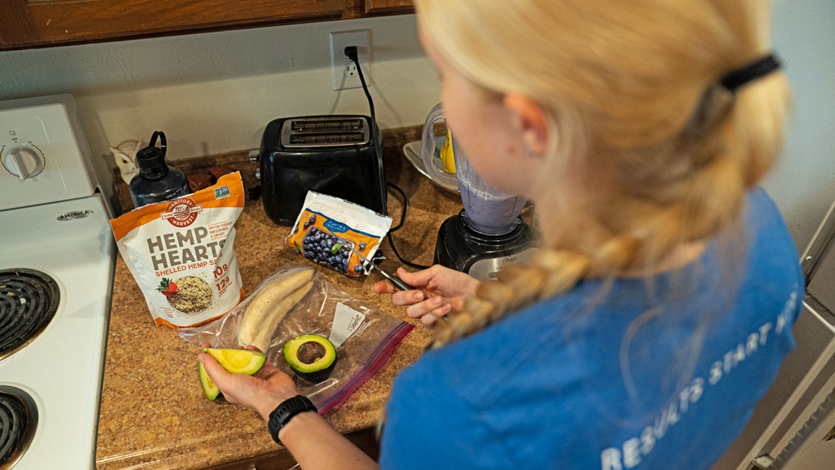 Endurance Athlete Nutritional Teamwork 60189 A Woman Athlete Making A Healthy Meal In Her Kitchen