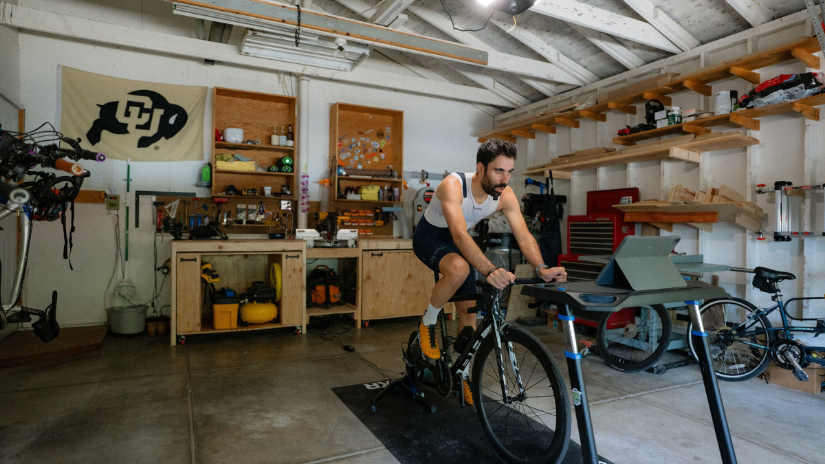 Cyclist Doing Training Camp Workout On Indoor Bike At Home